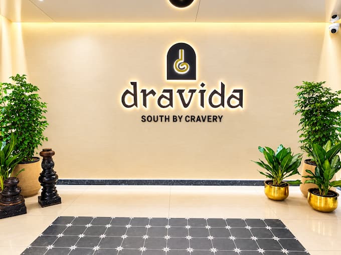 Main branding for Dravida South By Cravery restaurant.
